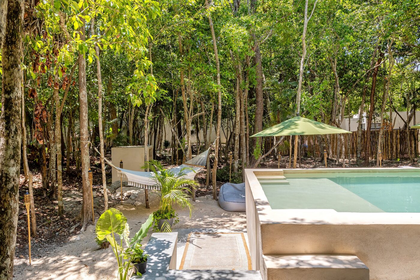 The pool and hammock among the trees